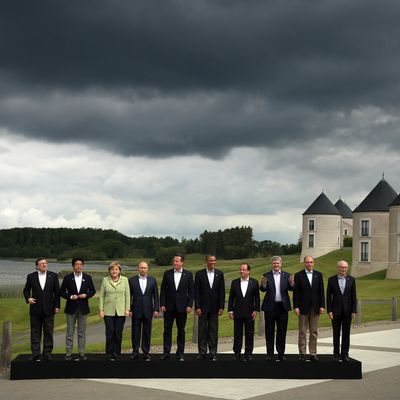 ENNISKILLEN, NORTHERN IRELAND - JUNE 18: (L-R) President of the European Commission Jose Manuel Barroso, Japanese Prime Minister Shinzo Abe, German Chancellor Angela Merkel, Russia's President Vladimir Putin, Britain's Prime Minister David Cameron, US President Barack Obama, French President Francois Hollande, Canadian Prime Minister Stephen Harper, Italian Prime Minister Enrico Letta and European Council President Herman Van Rumpuy, arrive for the 'family' group photograph at the G8 venue of Lough Erne on June 18, 2013 in Enniskillen, Northern Ireland. The two day G8 summit, hosted by UK Prime Minister David Cameron, is being held in Northern Ireland for the first time. Leaders from the G8 nations have gathered to discuss numerous topics with the situation in Syria expected to dominate the talks. (Photo by Matt Cardy/Getty Images)