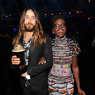 LOS ANGELES, CA - APRIL 13: Actor Jared Leto (L), winner of the Best On-Screen Transformation award for 'Dallas Buyers Club,' and actress Lupita Nyong'o attend the 2014 MTV Movie Awards at Nokia Theatre L.A. Live on April 13, 2014 in Los Angeles, California. (Photo by Kevin Mazur/WireImage)