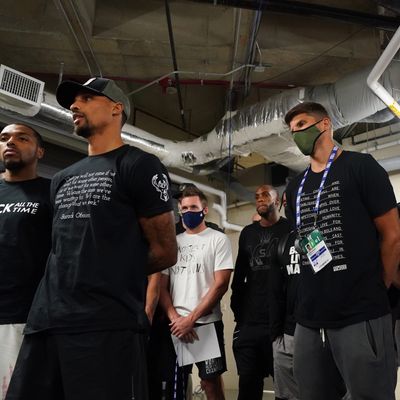 Kyle Korver and Giannis Antetokounmpo of the Milwaukee Bucks during the statement to the media on August 26, 2020 at AdventHealth Arena at ESPN Wide World of Sports Complex in Orlando, Florida.