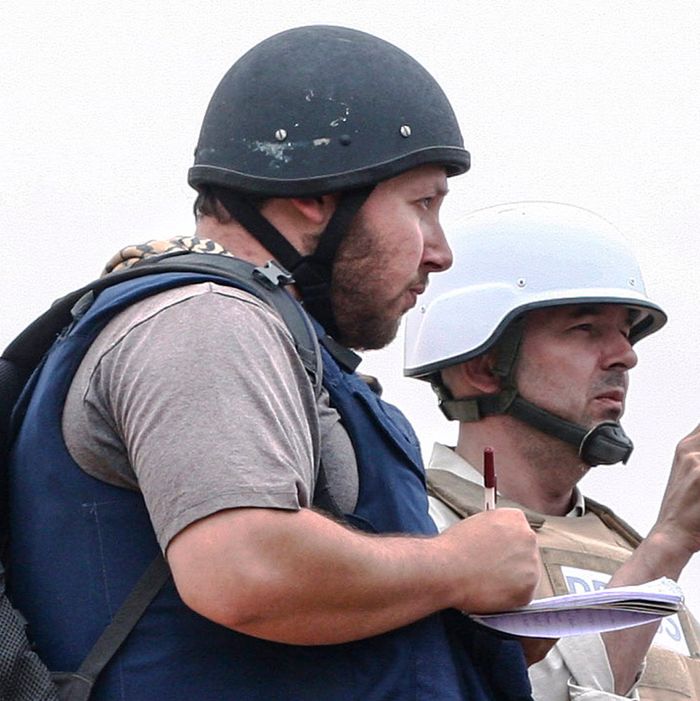 In this handout image made available by the photographer American journalist Steven Sotloff (Center with black helmet) talks to Libyan rebels on the Al Dafniya front line, 25 km west of Misrata on June 02, 2011 in Misrata, Libya. 
