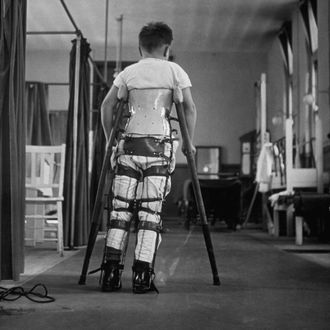 1947: A child suffering from Infantile Paralysis learning to walk with the aid of a special support, at Queen Mary's Hospital, London. 