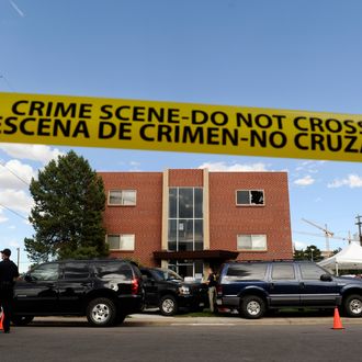 AURORA, CO - JULY 21: Police surround the apartment of James Holmes, the suspect in the Colorado theater shooting, on July 21, 2012 in Aurora, Colorado. Numerous explosive devices were found in the apartment and successfully disarmed. According to reports, 12 people have been killed and over 59 injured including 9 in critical condition. (Photo by Chris Schneider/Getty Images)
