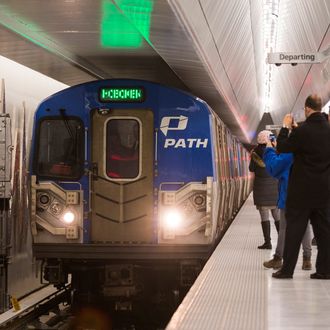 NEW YORK, NY - FEBRUARY 25: The first PATH train arrives at the opening of a new platform for the New Jersey PATH Train at the World Trade Center, on February 25, 2014 in New York City. The platform will primarily service PATH trains from Hoboken, NJ, to New York, NY - it is expected to service 100,000 riders a day. (Photo by Andrew Burton/Getty Images)