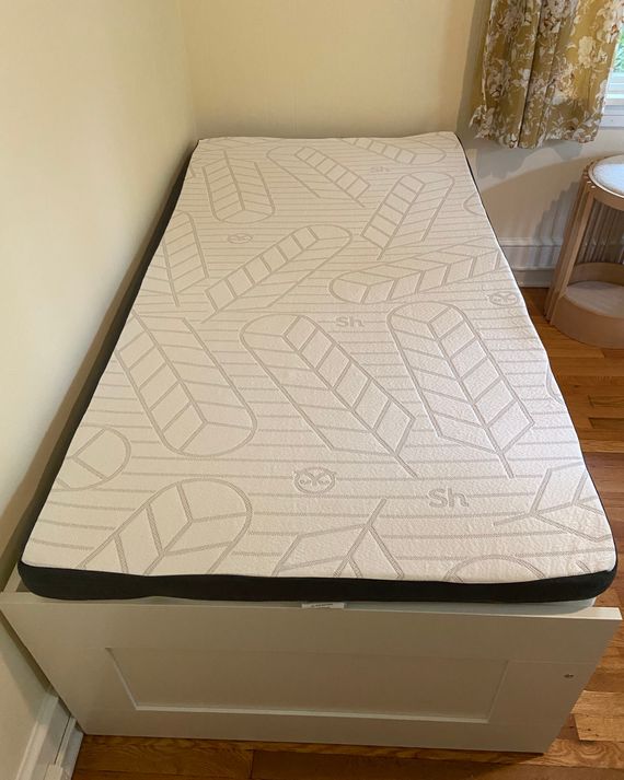 A mattress topper on a daybed.