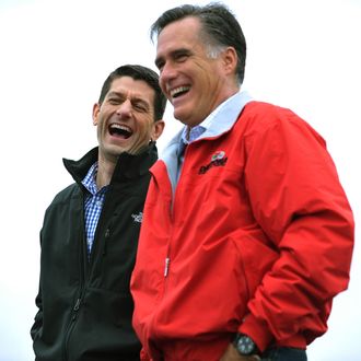 Republican presidential candidate Mitt Romney (R) and running-mate Paul Ryan share a laugh as they are introduced at a campaign rally September 25, 2012 at Dayton International Airport in Vandalia, Ohio. 