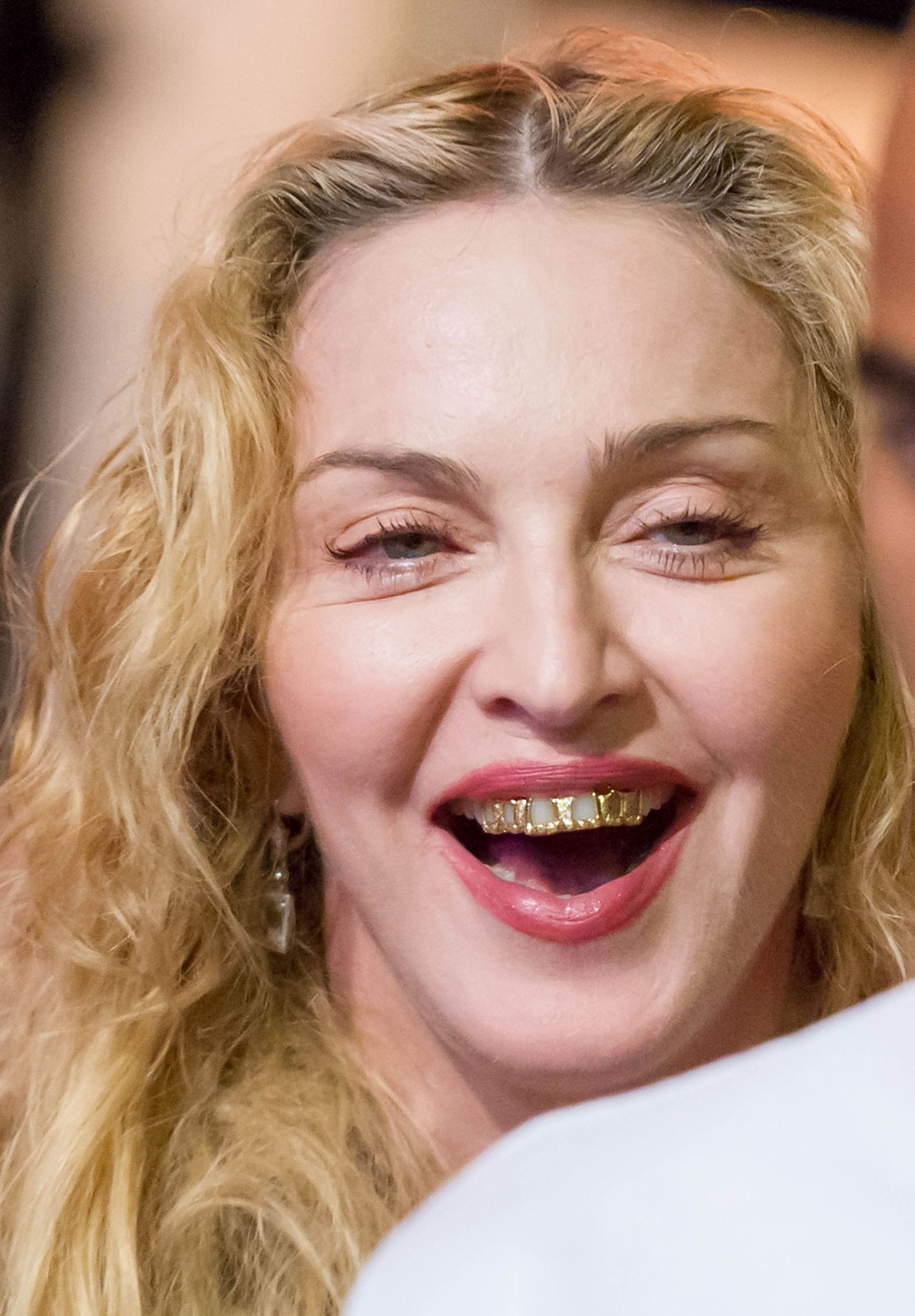 Madonna wears a grill and it looks awful