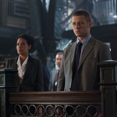 GOTHAM: An unwelcome visitor searches for Detective James Gordon (Ben McKenzie, R) at the GCPD in the 