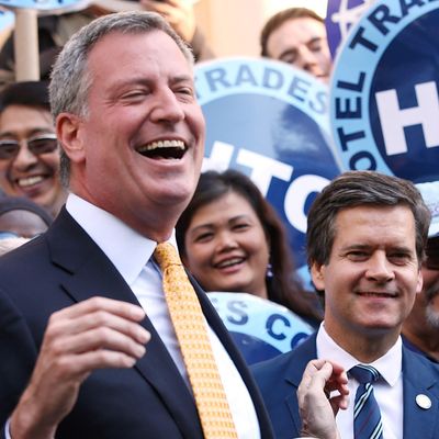 NEW YORK, NY - SEPTEMBER 17: Democratic mayoral nominee Bill de Blasio (L) laughs with Christine Quinn (2nd R), New York City Council Speaker and former mayoral hopeful, at a news conference where Quinn endorsed de Blasio outside City Hall on September 17, 2013 in New York City. De Blasio will face Republican Joseph Lhota in the general mayoral election November 5, 2013, with the winner succeeding current Mayor Michael Bloomberg. (Photo by Mario Tama/Getty Images)