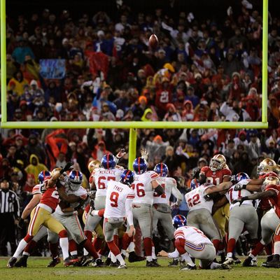 SAN FRANCISCO, CA - JANUARY 22: Lawrence Tynes #9 of the New York Giants kicks a successful 31-yard field goal in overtime against the San Francisco 49ers during the NFC Championship Game at Candlestick Park on January 22, 2012 in San Francisco, California. (Photo by Thearon W. Henderson/Getty Images)