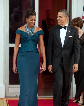 U.S. President Barack Obama, right, and first lady Michelle Obama walk to greet David Cameron, U.K. prime minister, and his wife Samantha Cameron on the North Portico of the White House in Washington, D.C., U.S., on Wednesday, March 14, 2012. Obama and Cameron showed a united front on finishing the war in Afghanistan and pressing for change in Iran and Syria, seeking to consolidate international support before a North Atlantic Treaty Organization meeting in May.