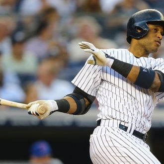 Robinson Cano #24 of the New York Yankees hits a home run in the third inning against the New York Mets during their game on May 30, 2013 at Yankee Stadium in the Bronx borough of New York City.