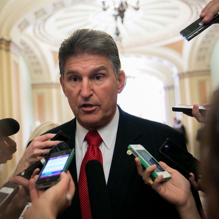 WASHINGTON, DC - SEPTEMBER 17: Sen. Joe Manchin (D-WV) talks to reporters before heading to a Senate Democratic policy luncheon, on Capitol Hill, September 17, 2013 in Washington, DC. Manchin discussed gun control issues with reporters in light of the Navy Yard shootings in Washington yesterday. (Photo by Drew Angerer/Getty Images)