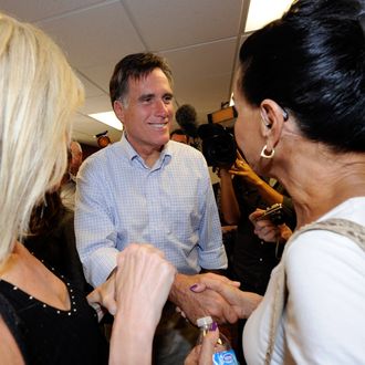 LAS VEGAS, NV - OCTOBER 17: Former Massachusetts Gov. and Republican presidential hopeful Mitt Romney (C) greets supporters as he opens his Nevada campaign headquarters October 17, 2011 in Las Vegas, Nevada. Romney and six other presidential contenders will participate in a debate airing on CNN, sponsored by the Western Republican Leadership Conference in Las Vegas on October 18. (Photo by Ethan Miller/Getty Images)