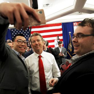 Republican presidential candidate U.S. Senator Rand Paul poses for a selfie with an audience member after speaking at the First in the Nation Republican Leadership Conference in Nashua