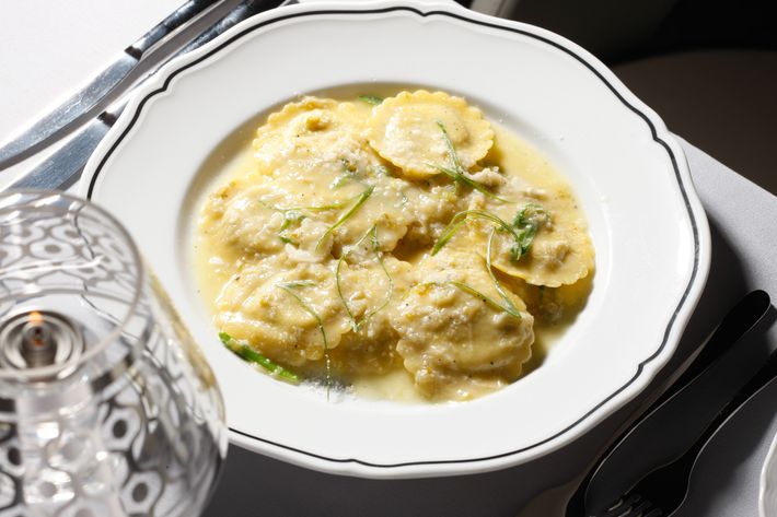 Pancetta-onion-and-Pecorino-filled ravioli with spring-onion butter.