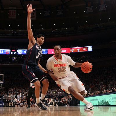 Kris Joseph #32 of the Syracuse Orange handles the ball against Jeremy Lamb #3 of the Connecticut Huskies during the quarterfinals of the Big East Men's Basketball Tournament