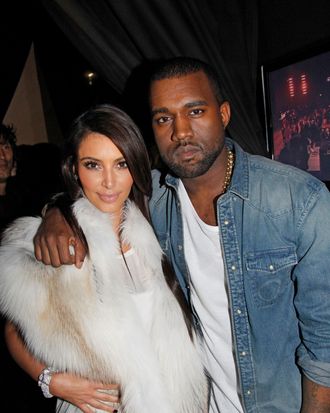 Kim Kardashian and Kanye West attend the Kanye West Ready-To-Wear Fall/Winter 2012 show as part of Paris Fashion Week at Halle Freyssinet on March 6, 2012 in Paris, France.