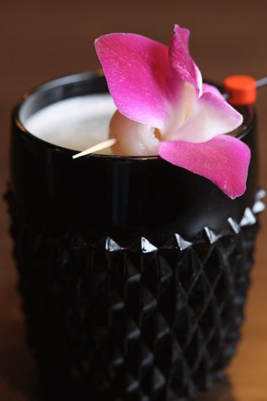 A cocktail garnished with lychee.