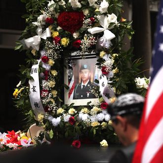 A portrait of Army Pvt. Danny Chen is viewed on a car in his funeral procession in Chinatown on October 13, 2011 in New York City.