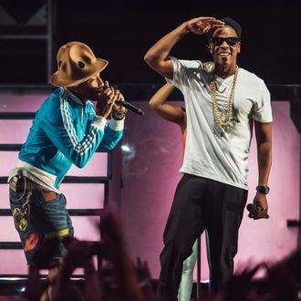 INDIO, CA - APRIL 19: Musicians Pharrell Williiams (L) and Jay Z perform onstage during day 2 of the 2014 Coachella Valley Music & Arts Festival at the Empire Polo Club on April 19, 2014 in Indio, California. (Photo by Christopher Polk/Getty Images for Coachella)