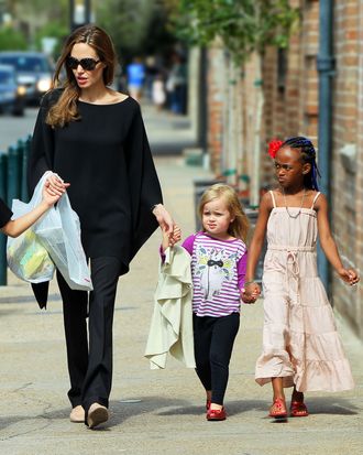 Vivienne Jolie-Pitt and big sister Zahara walk the streets of New Orleans together hand-in-hand.