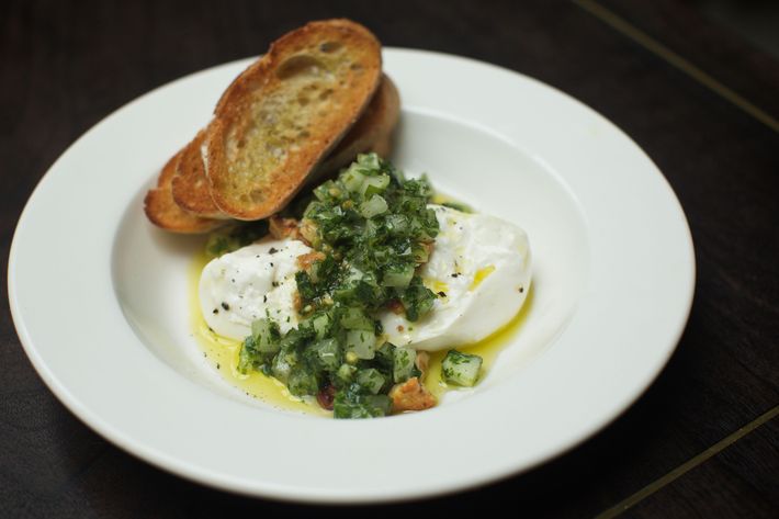 Burrata with green-tomato salsa verde and walnuts.