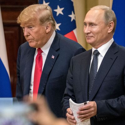 President Donald Trump and Russian President Vladimir Putin arrive to waiting media during a joint press conference after their summit on July 16, 2018 in Helsinki, Finland.