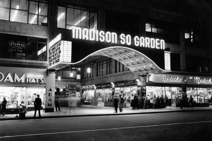 Madison Square Garden (b. 1925, d. 1968). Nedick's, the frankfurter chain, has its sign on the other side of the entrance in the film.