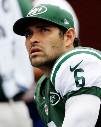 New York Jets quarterback Mark Sanchez (6) looks up from the sidelines during the second half of an NFL football game against the Miami Dolphins, Sunday, Sept. 23, 2012, in Miami.