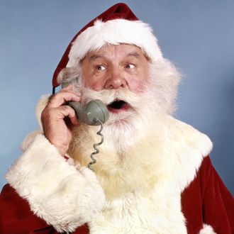 1960s SANTA CLAUS TALKING ON TELEPHONE RETRO