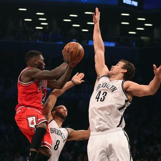 NEW YORK, NY - APRIL 29: Kris Humphries #43 of the Brooklyn Nets blocks Nate Robinson #2 of the Chicago Bulls during Game Five of the Eastern Conference Quarterfinals of the 2013 NBA Playoffs at the Barclays Center on April 29, 2013 in New York City. NOTE TO USER: User expressly acknowledges and agrees that, by downloading and or using this photograph, User is consenting to the terms and conditions of the Getty Images License Agreement. (Photo by Bruce Bennett/Getty Images)