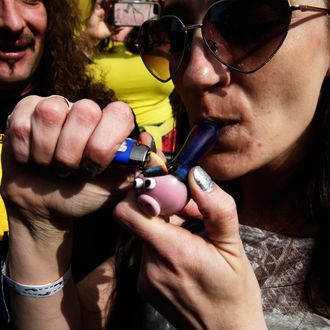  Ryme Windham smokes marijuana at 4:20 pm outside at Hempfest on April 20, 2014 in Seattle, Washington. Seattle Hempfest is an annual event for the purpose of educating the public about the benefits of marijuana and advocating for its decriminalization. 