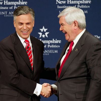 MANCHESTER, NH - DECEMBER 12: Republican Presidential Candidates Newt Gingrich (R) and Jon Huntsman shake hands foloowing a Lincoln-Douglas style debate at Saint Anselm College on December 12, 2011 in Manchester, New Hampshire. The debate will primarily delve into national security and foreign policy. (Photo by Matthew Cavanaugh/Getty Images)