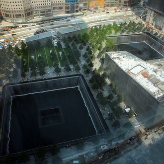 NEW YORK, NY - SEPTEMBER 07: The reflective pool at The National September 11 Memorial Museum is viewed on September 7, 2012 in New York City. As New York City and the country prepare for the 11th anniversary of the September 11, 2001 terrorist attacks, work proceeds at the former site of the World Trade Center Towers. The 16-acre site, which is owned by the Port Authority of New York and New Jersey and is being rebuilt with developer Larry Silverstein, has a projected price tag of $14.8 billion. Of the four office towers planned for the site, two have had finishing beams placed on their top floors and the above-ground memorial was completed in time for the 10th anniversary last year. (Photo by Spencer Platt/Getty Images)