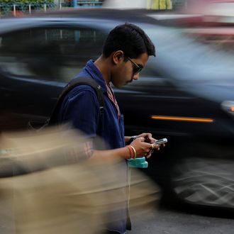 Commuters browse internet on street