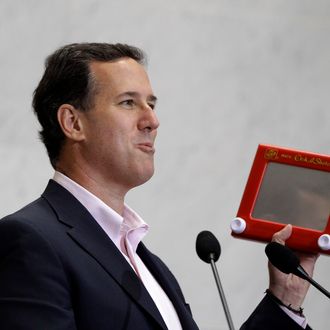 Republican presidential candidate, former Pennsylvania Sen. Rick Santorum holds an Etch A Sketch as he speaks to USAA employees during a campaign stop, Thursday, March 22, 2012, in San Antonio.