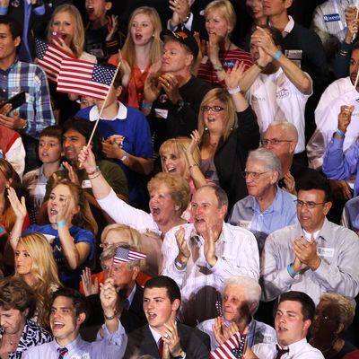 The crowd gathered in support of Mitt Romney cheers as the polls close at 8 p.m. EST, on primary night in Florida.