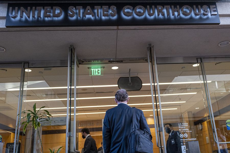 John Cline, Holmes's attorney, arrives at federal court in San Jose, California.