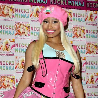 LONDON, ENGLAND - APRIL 19: Nicki Minaj signs copies of her number one album 'Pink Friday: Roman Reloaded' at HMV Bayswater on April 19, 2012 in London, England. (Photo by Danny Martindale/Getty Images)