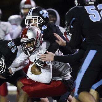 Blair's Daymon Anderson gets tackled by the Whitman offense after making an interception during the last regular season game on Friday, November 7, 2014. Blair defeated Whitman 41-0 and earned a spot in the playoffs. 