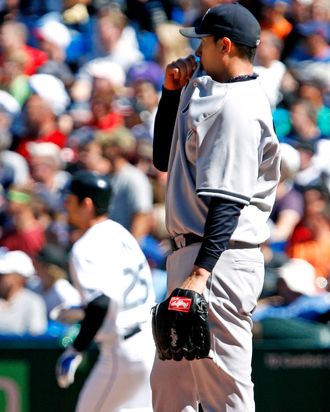 TORONTO, CANADA - SEPTEMBER 18: Freddy Garcia #36 of the New York Yankees reacts as Adam Lind #26 of the Toronto Blue Jays rounds the bases after his solo home run during MLB action at the Rogers Centre September 18, 2011 in Toronto, Ontario, Canada. (Photo by Abelimages/Getty Images)