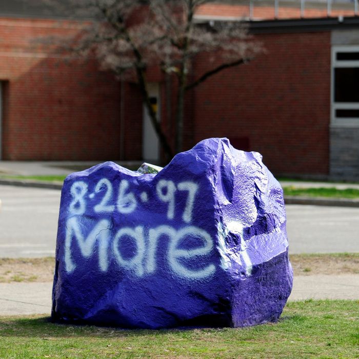 A rock spray-painted by students sits in memory of 16-year-old stabbing victim Maren Sanchez on Friday, April 25, 2014, sits outside Jonathan Law High School in Milford, Conn. Sanchez was stabbed to death earlier during an altercation inside the school. A teenage boy is in custody, and police are investigating whether she was stabbed because she declined to be his date at the junior prom. (AP Photo/The New Haven Register, Peter Hvizdak) MANDATORY CREDIT