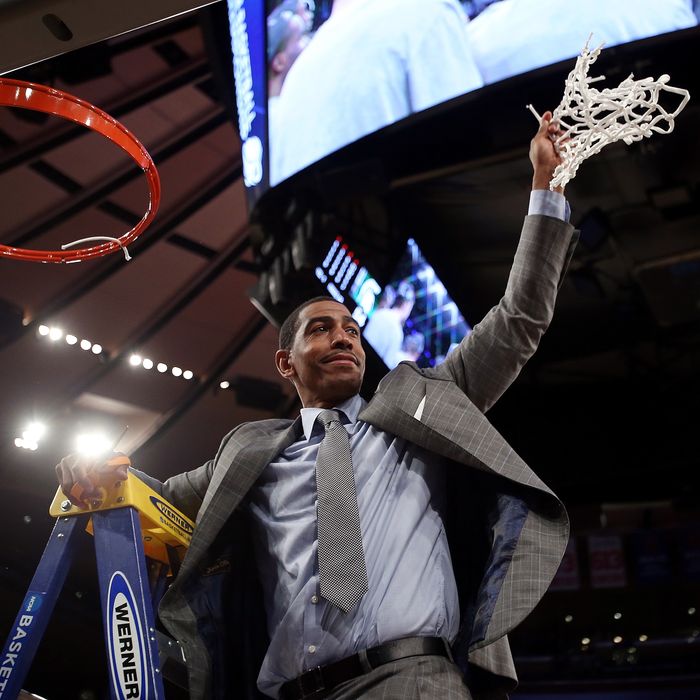 NEW YORK, NY - MARCH 30: Head coach Kevin Ollie of the Connecticut Huskies cuts down the net after defeating the Michigan State Spartans to win the East Regional Final of the 2014 NCAA Men's Basketball Tournament at Madison Square Garden on March 30, 2014 in New York City. (Photo by Bruce Bennett/Getty Images)