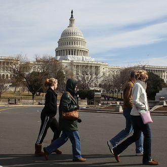 Tourists walk past the U.S. Capitol building, on February 17, 2012 in Washington, DC. Earlier today the FBI arrested a man with possible ties to al-Qaeda, for plotting to blow up the U.S. Capitol building in an apparent suicide attack.