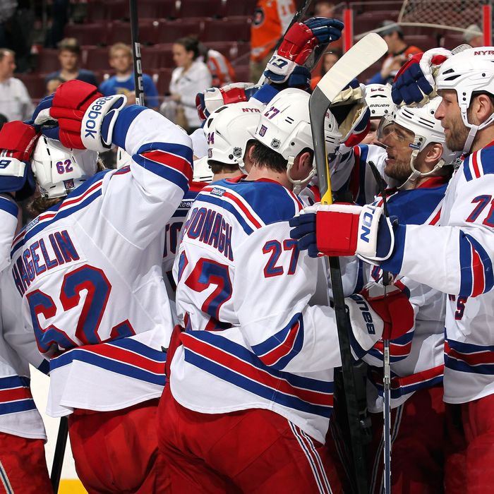 Members of the New York Rangers celebrate after defeating the Philadelphia Flyers 5-3 on April 3, 2012 at the Wells Fargo Center in Philadelphia, Pennsylvania.