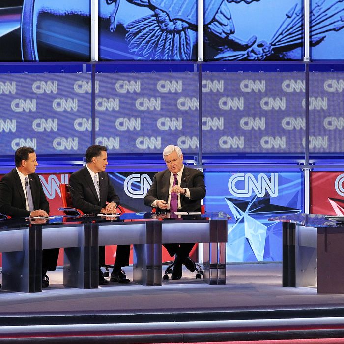(L-R) Republican presidential candidates U.S. Rep. Ron Paul (R-TX), former U.S. Sen. Rick Santorum, former Massachusetts Gov. Mitt Romney and former Speaker of the House Newt Gingrich participate in a debate sponsored by CNN and the Republican Party of Arizona