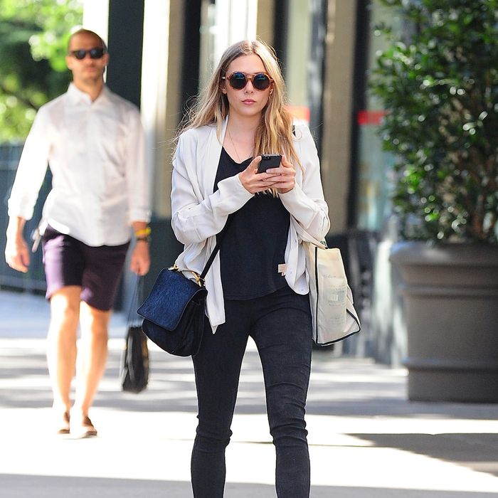 Elizabeth Olsen Visits Pastis; Sly and Arnold Rip Through a Magnum of ...