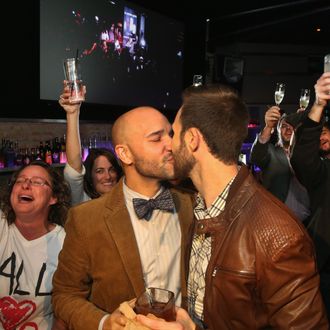 CHICAGO, IL - NOVEMBER 05: Fernando Mojica (L) celebrates with Drew Freeman at the Side Track bar after the Illinois General Assembly approved a gay marriage bill on November 5, 2013 in Chicago, Illinois. The governor has said he will sign the bill which will make Illinois the 15th state to legalize same-sex unions. (Photo by Scott Olson/Getty Images)