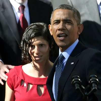 WASHINGTON, DC - OCTOBER 21: U.S. President Barack Obama holds onto Karmel Allison who has Type 1 Diabetes and felt light headed while he was delivering remarks about the error-plagued launch of the Affordable Care Act's online enrollment website in the Rose Garden of the White House October 21, 2013 in Washington, DC. According to the White House, the president was joined by 'consumers, small business owners, and pharmacists who have either benefitted from the health care law already or are helping consumers learn about what the law means for them and how they can get covered. 'Despite the new health care law's website problems, Obama urged Americans not to be deterred from registering for Obamacare because of the technological problems that have plagued its rollout. (Photo by Mark Wilson/Getty Images)