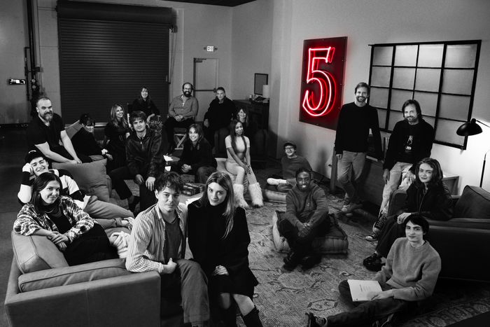 Stranger Things cast in behind-the-scenes group photo with “5” on the wall